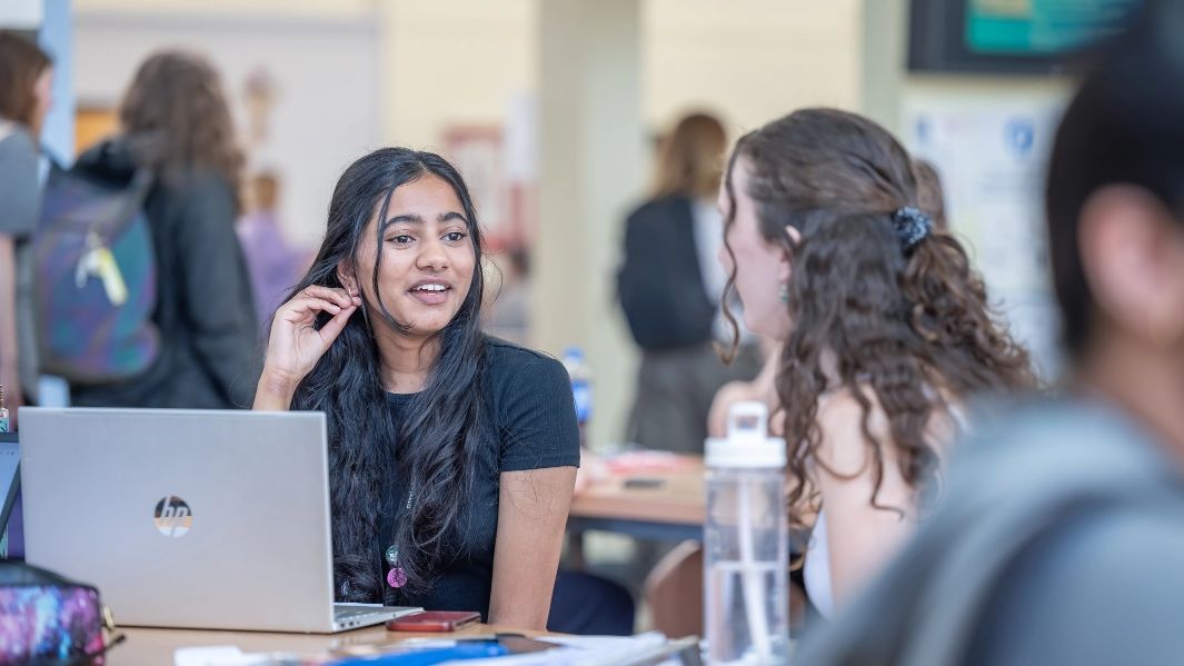 Students talking in the canteen.