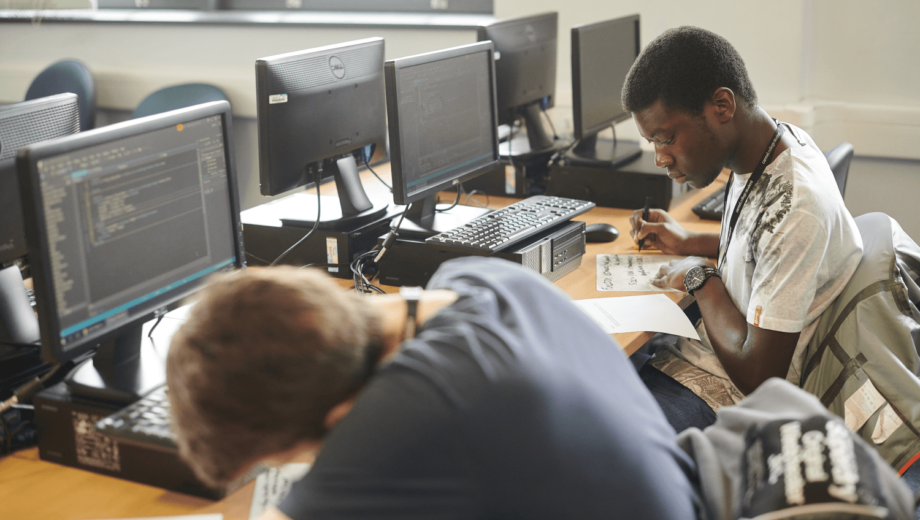 Students working at computers in classroom