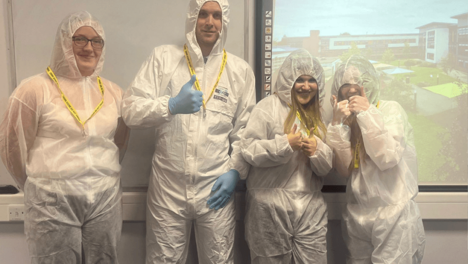 students in Crime scene suits