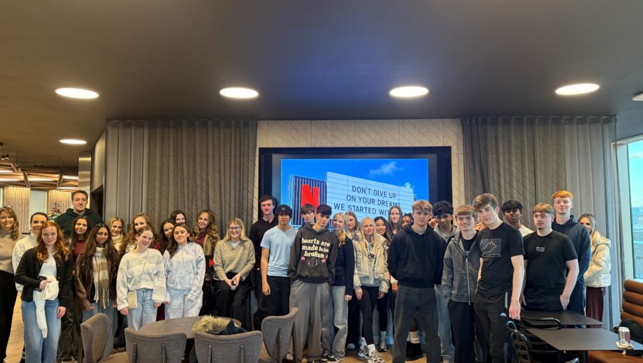 A group of Business Studies students in a presentation room on a trip to London