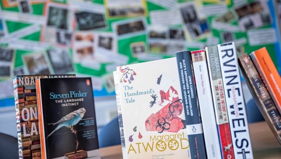 Eight English Books stood up in a row on a table in st helens sixth form