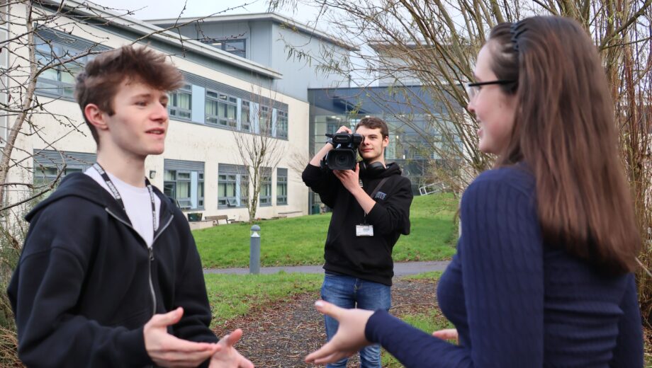 Photo of male and female students using film equipment