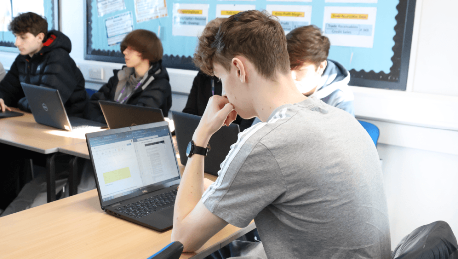 Student looking at laptop. level 3 college course