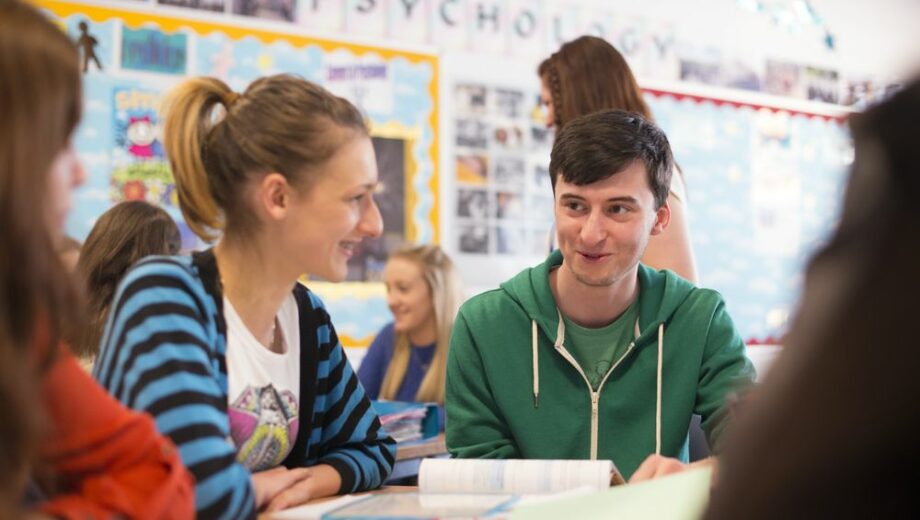 Photo of male and female students in a classroom