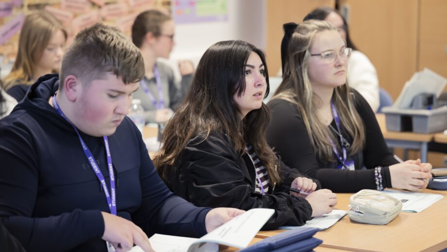 students sat at desks in a classrrom