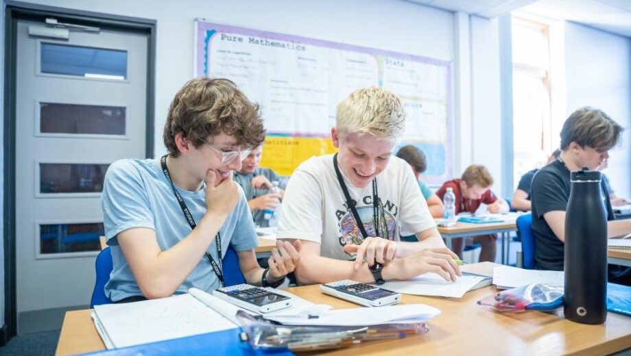 Two students studying a level Maths