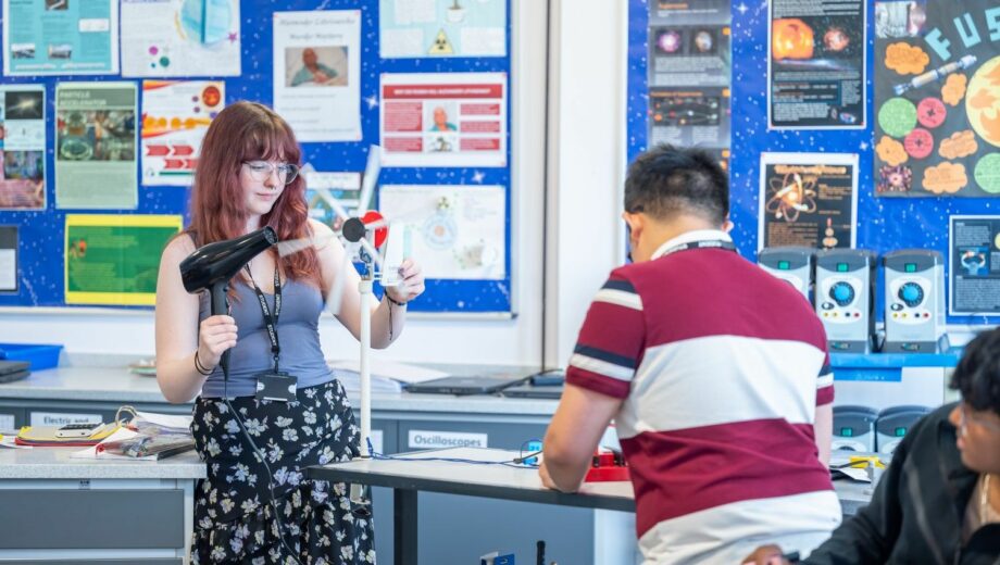 Student using hairdryer to make a windmill move