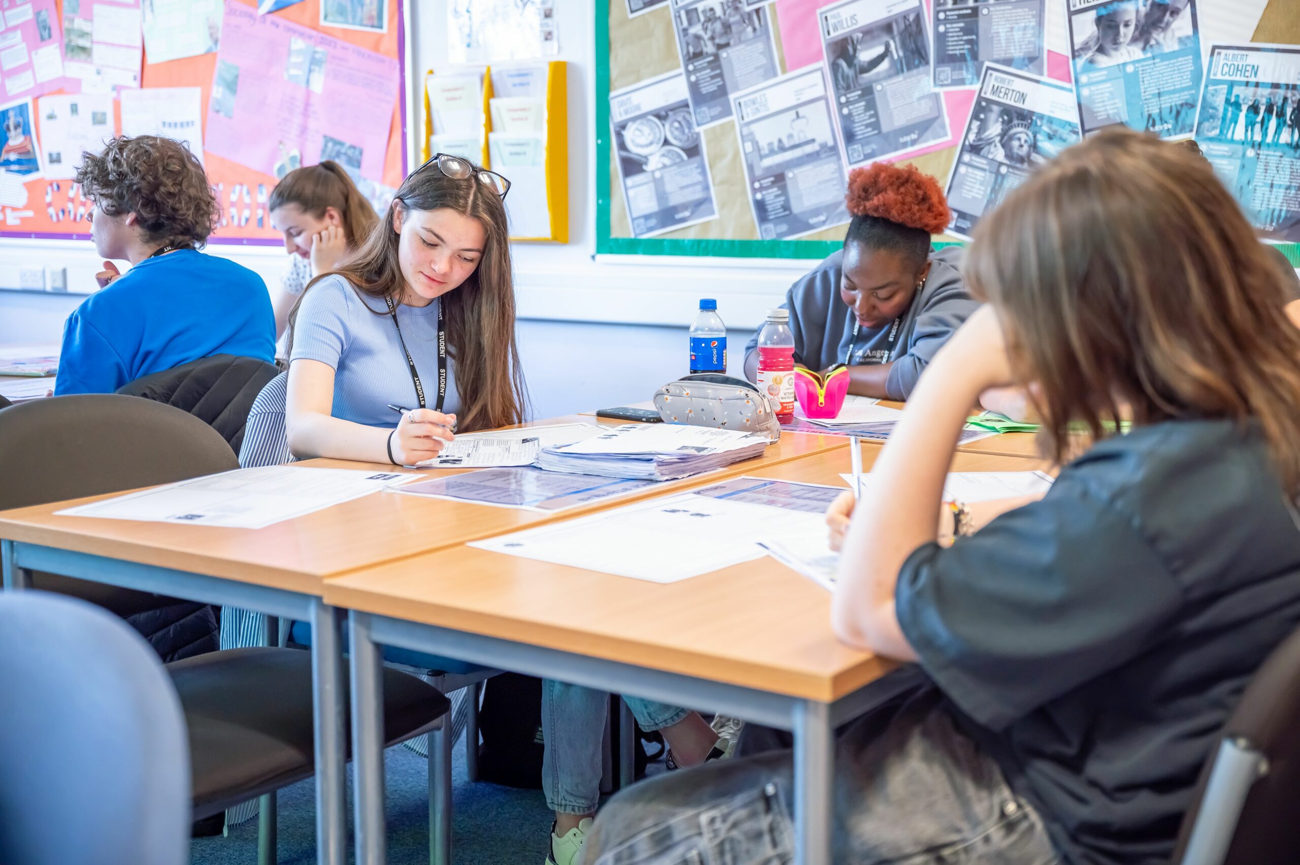 Sociology students sat in the classroom writing.