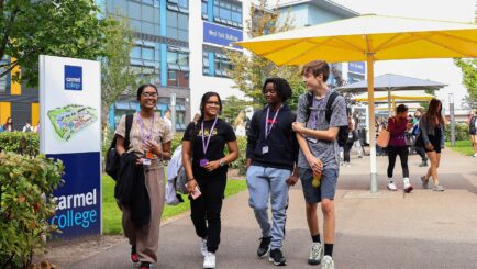 Sixth Form students walking the Carmel College Campus.