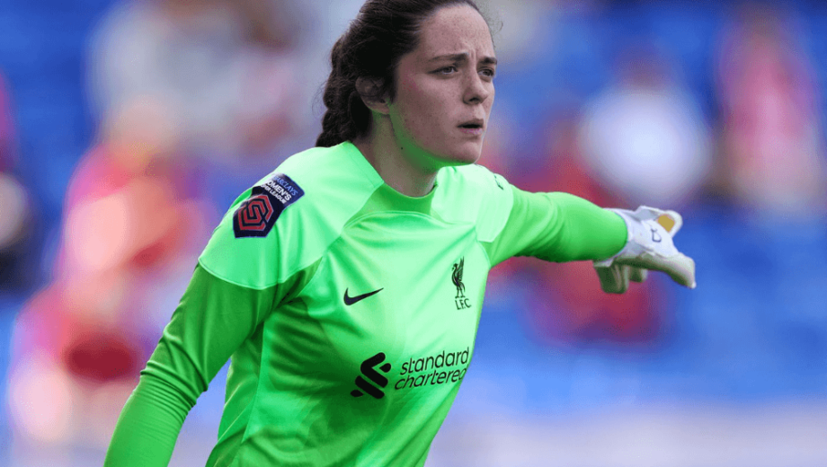 Female student in Liverpool Football kit