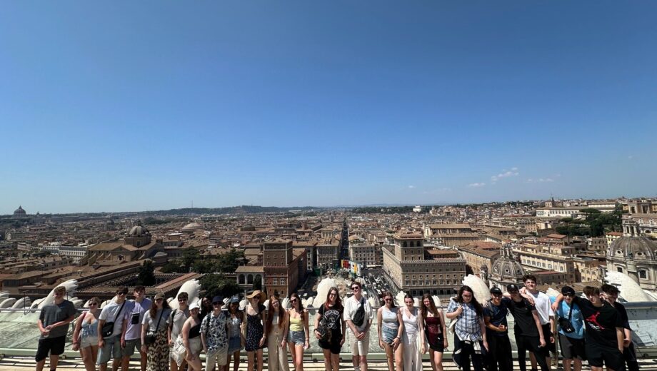 Group of students stood at a landmark in Rome