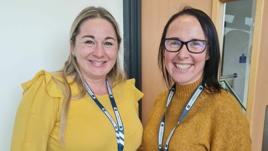 2 female staff wearing yellow