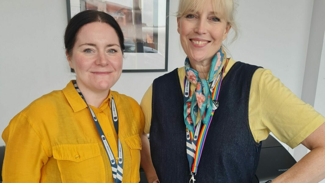 2 female tutors wearing yellow