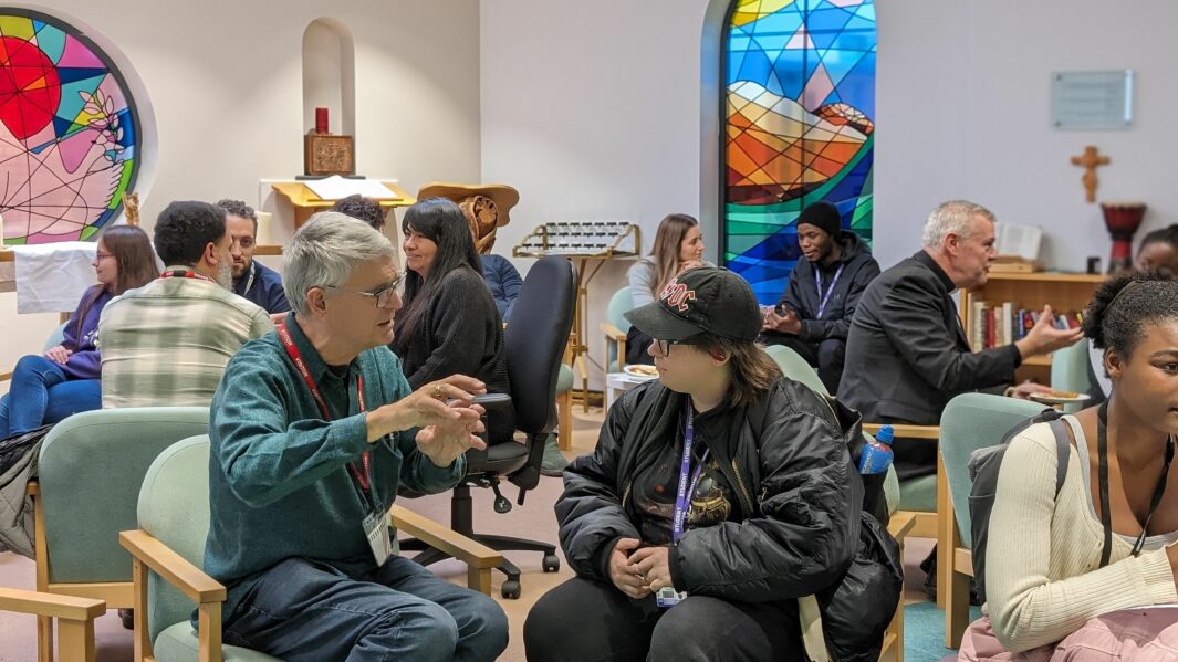 Man and male student talking in Chalaincy at Carmel