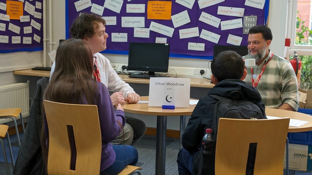 Students taking part in speed faithing event in library