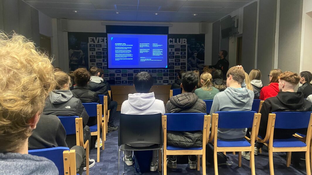 Students watching a TV screen at Finch Farm