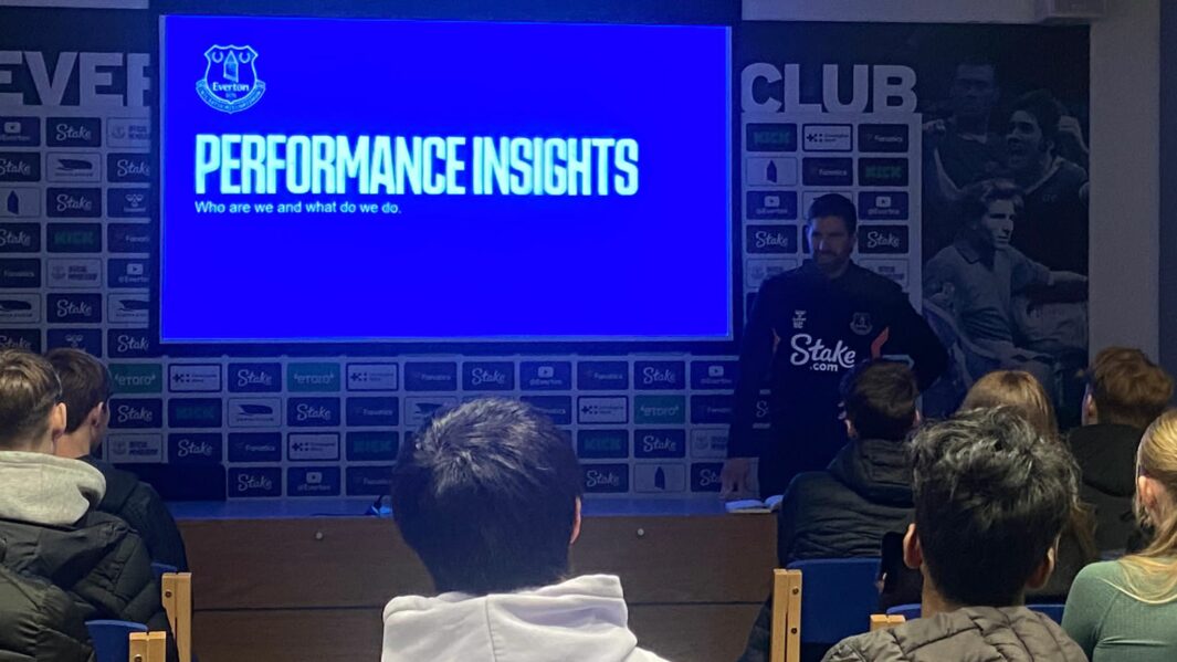 Students watching a screen