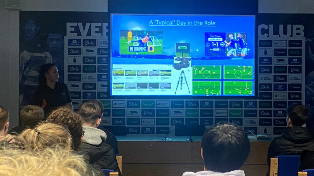 Students watching a TV screen at Finch Farm