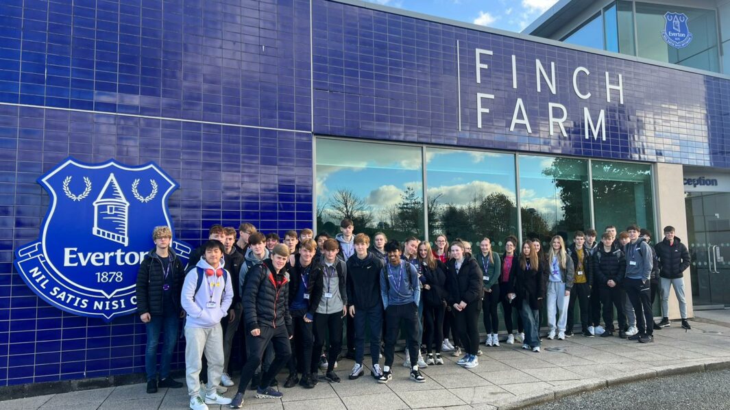 Group of PE students outside Everton's Finch Farm ground. college near me