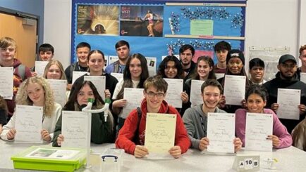 Group of Chemistry students holding Cambridge Chemistry Challenge certificates
