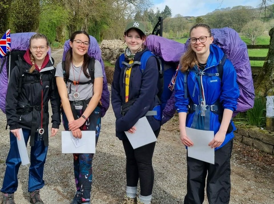Sixth form students in a lane wearing walking gear