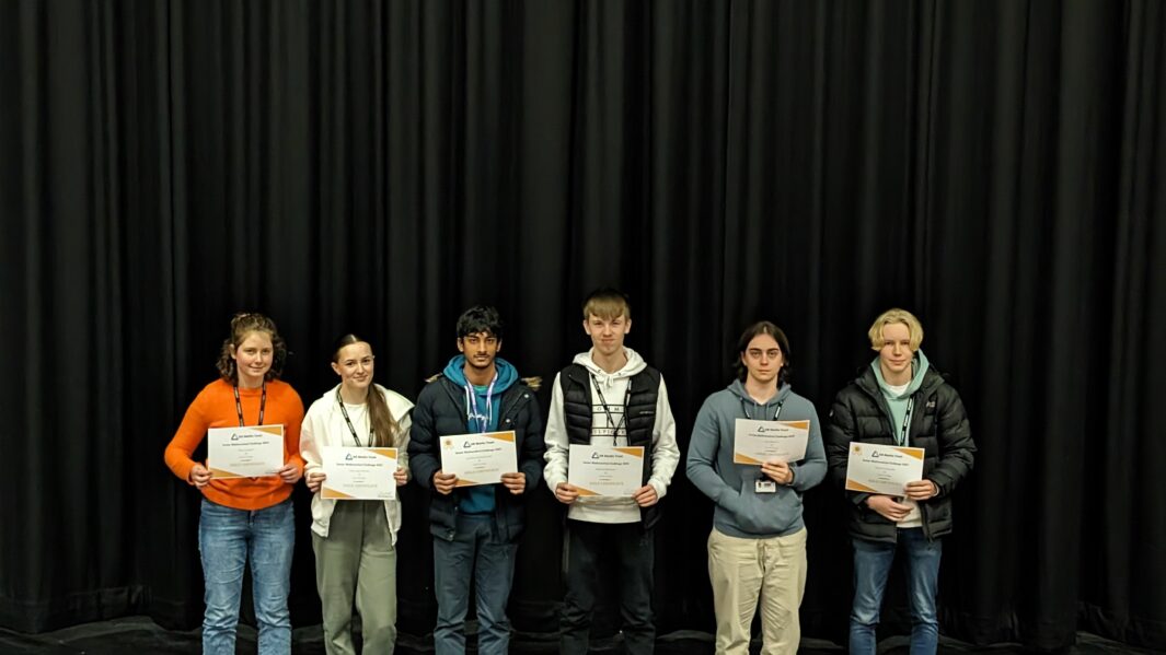 group of maths students with certificates