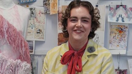 Student sat on chair posing