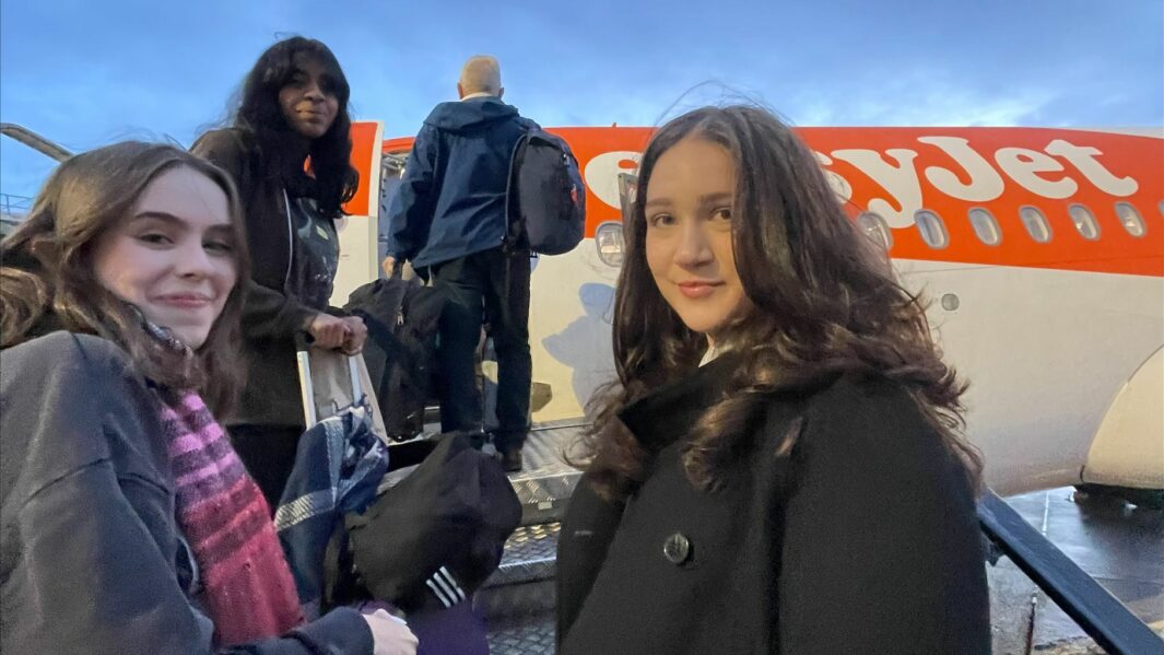Students getting on a plane