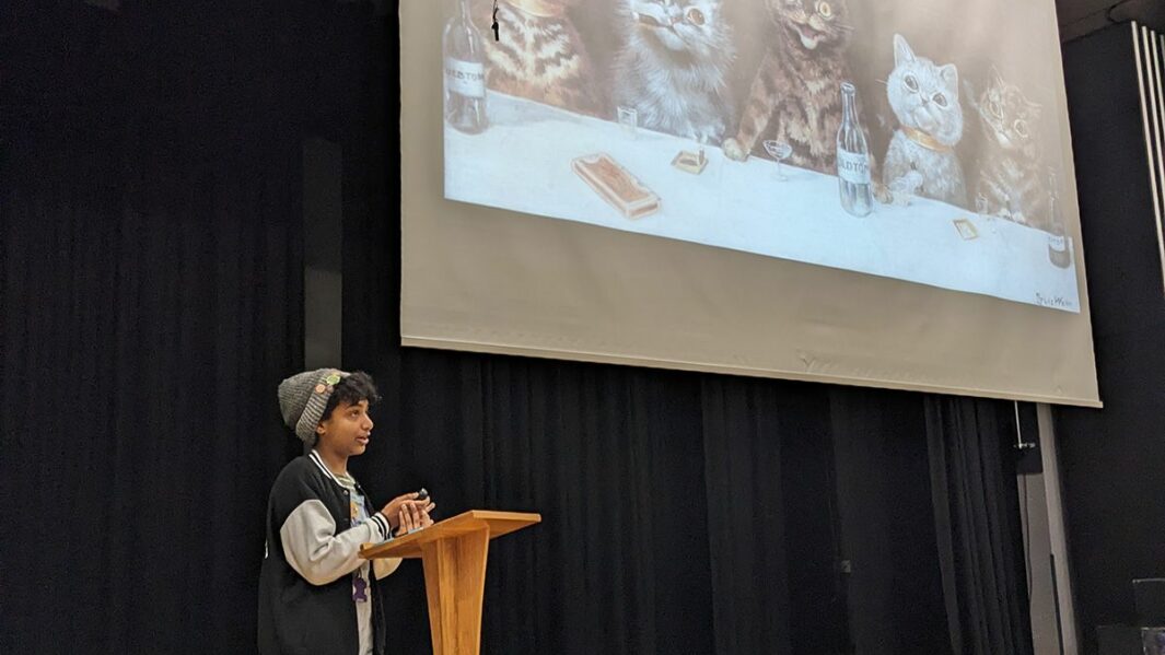 Male student presenting in the theatre
