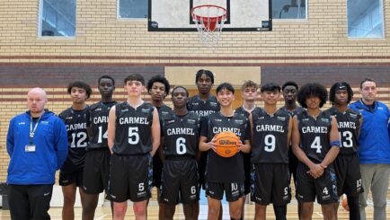 Photo of our bastball tam and coaches in kit in the Sports Hall at Carmel College