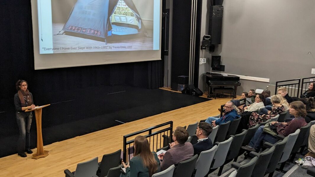 Female student presenting in the theatre