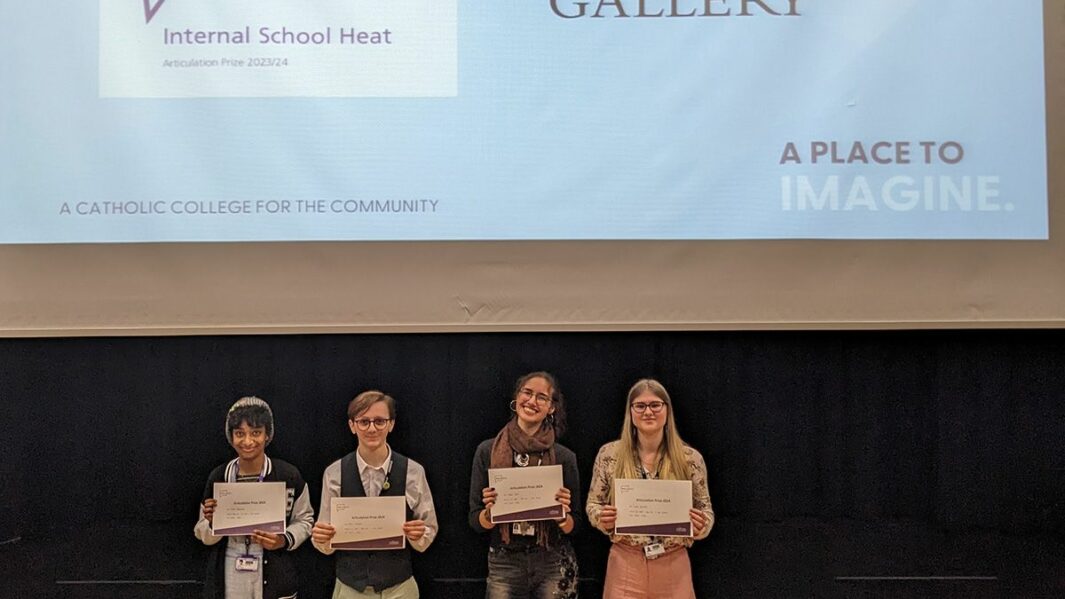 Four art students stood at front of Dalton Theatre