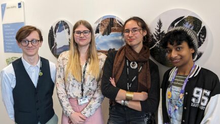 Four art students posing for portrait photo
