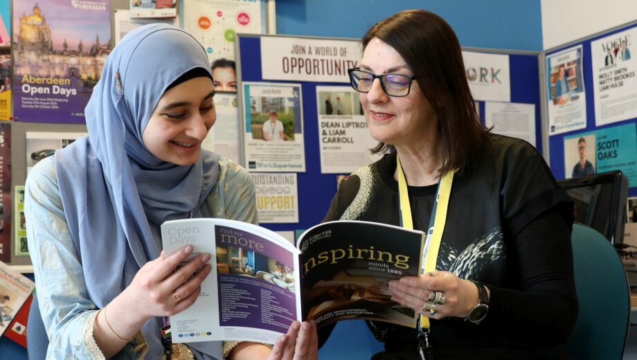 Female member of staff and female student in the careers area at carmel college