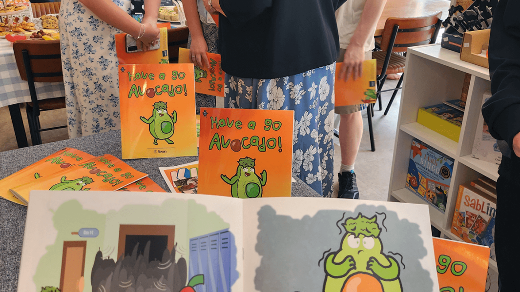 Councillor Jeanette Banks, Mayor of St Helens engages with the Foundation Learning authors of Have A Go Avocado from Carmel College