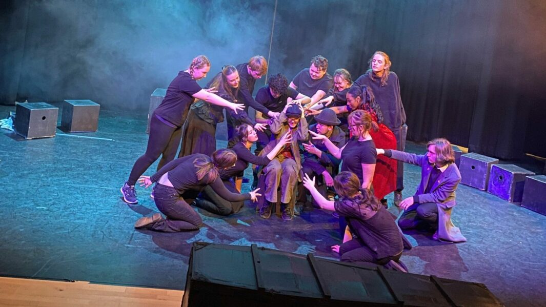 Group of students in a performance crowding together
