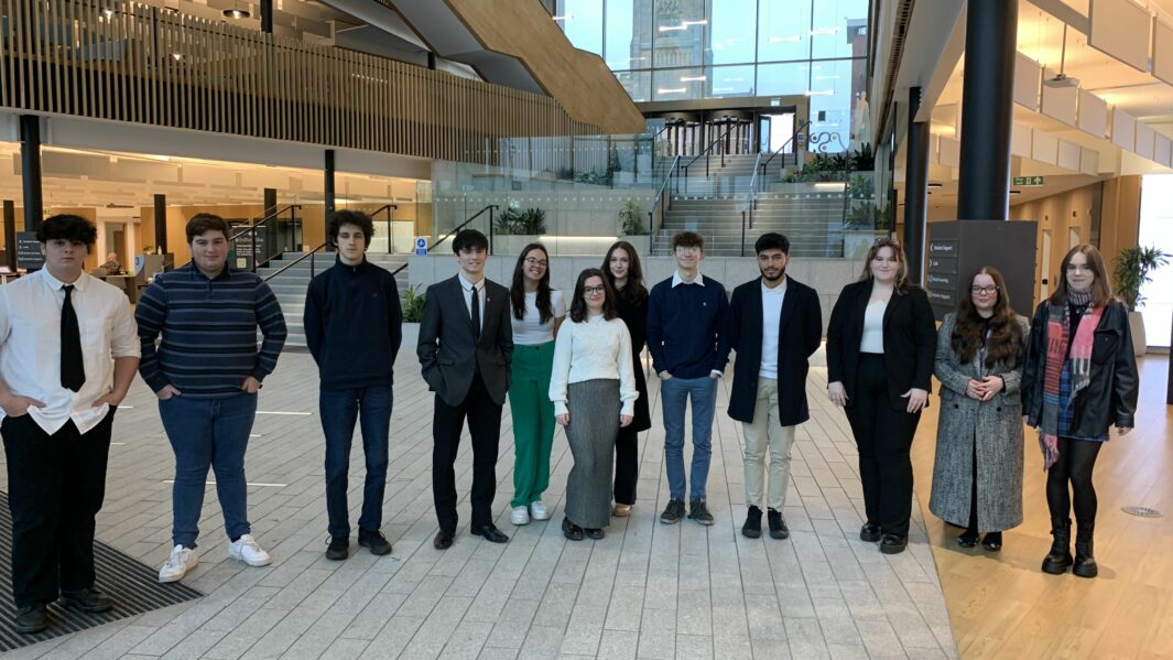 Group of students stood in a line at UCLAN