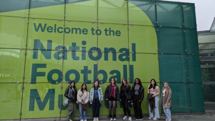 A group of 8 female students stood outside the National Football Museum