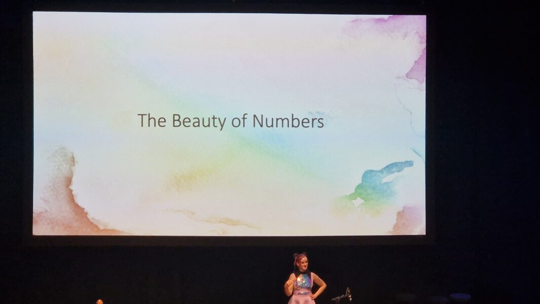 screen and a speaker delivering a talk at the Northern College of Music