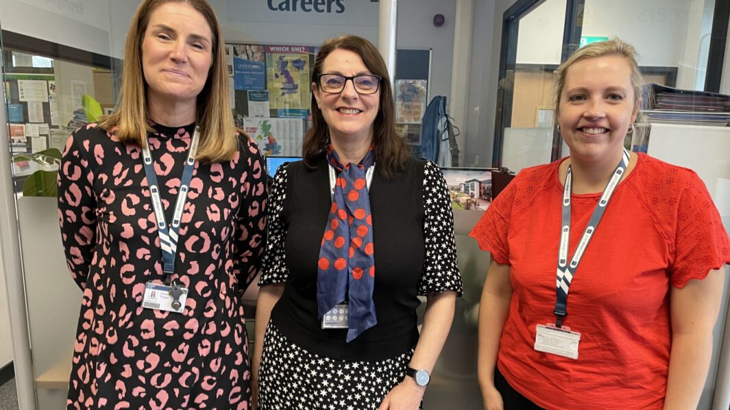 3 female members of staff wearing bright colours