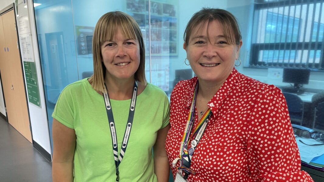 2 female staff members wearing bright colours