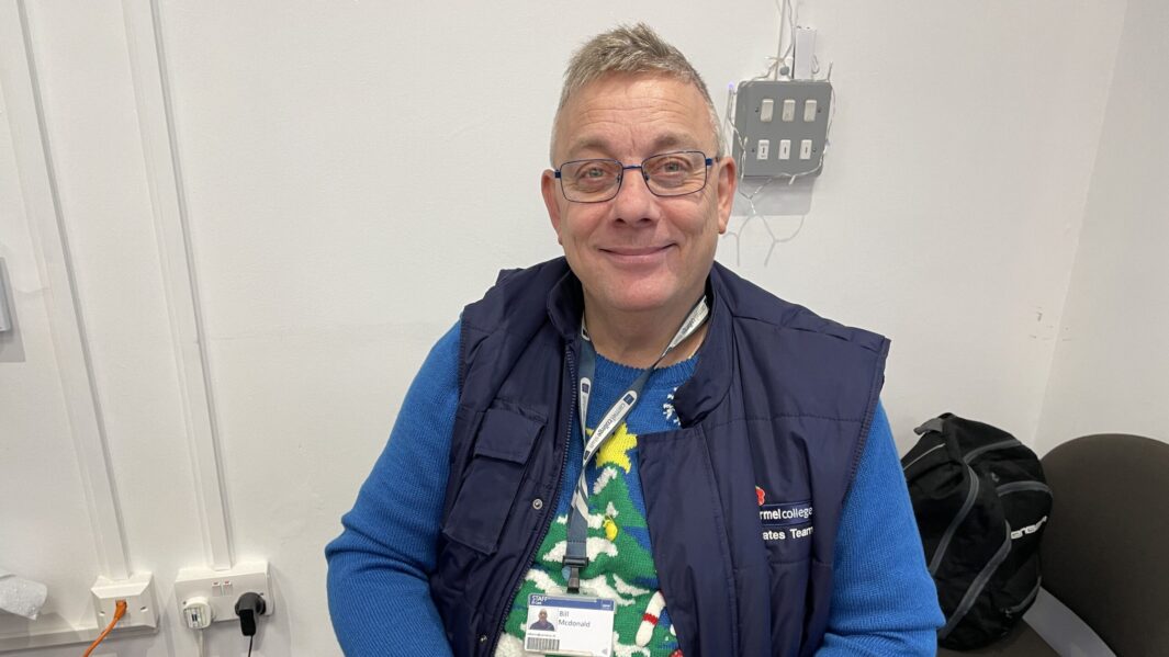 Security staff member wearing a christmas jumper