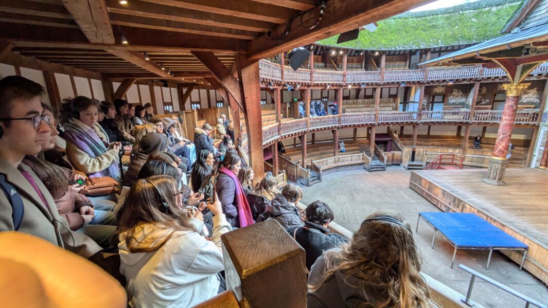 Art, Design and Performing Arts students from Carmel College sit in Shakespeare's Globe Theatre.