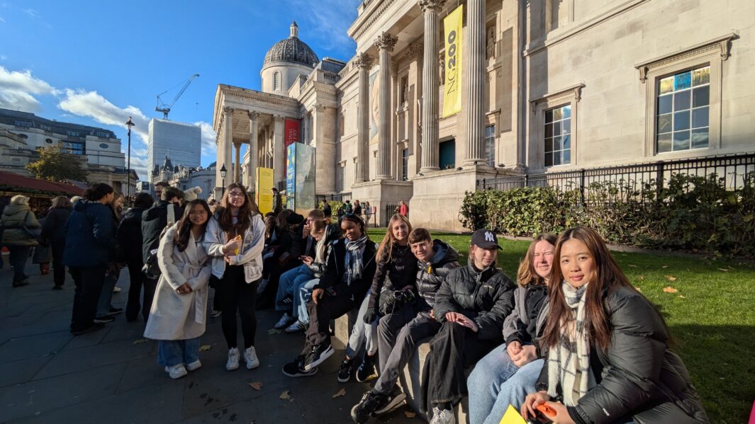 Group of Carmel College Art, Design & Performing Arts students sit outside The National Gallery.