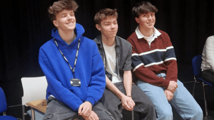 Three male Carmel College students take part in the second round of the ESU School's Mace Competition