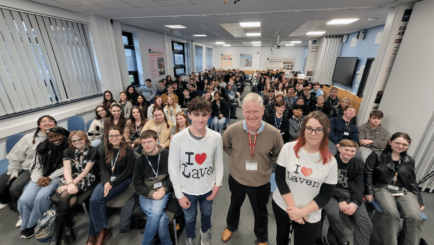 David Laven pictured with fifty Carmel College A Level History students, two wear 'I heart Laven' shirts.