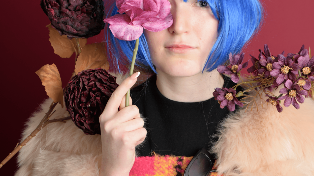 Student poses with flower accessories in fashion shoot as part of Lorraine Wirecko-Brobby's Art & Design workshop.