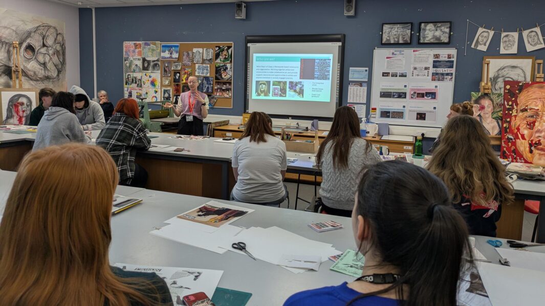 art and design workshop. students looking at the screen with a presenter at the front