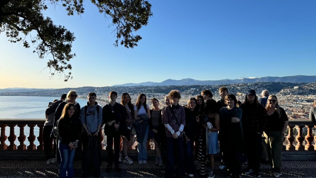 student group stood under a tree in Nice