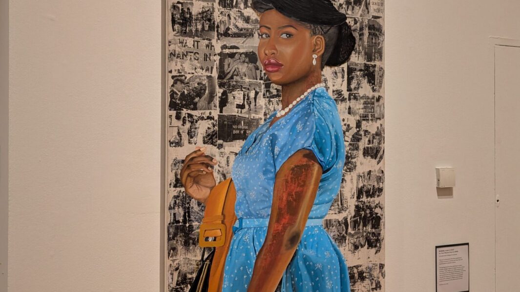 artwork in a Liverpool gallery of a black woman in front of a painting
